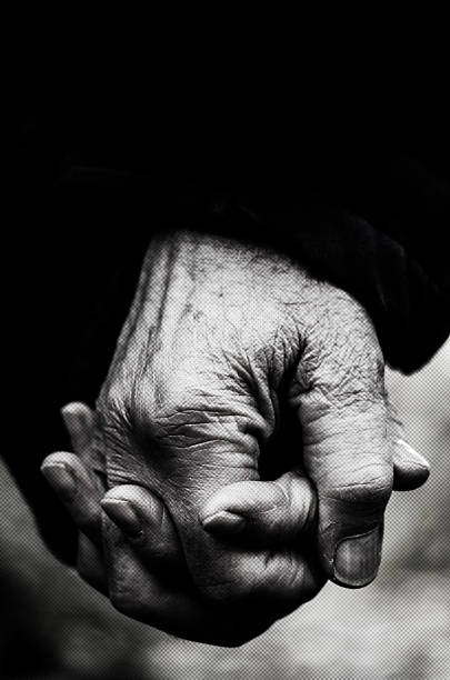 istock Old hands holding together, Monochrome Shot 510621140