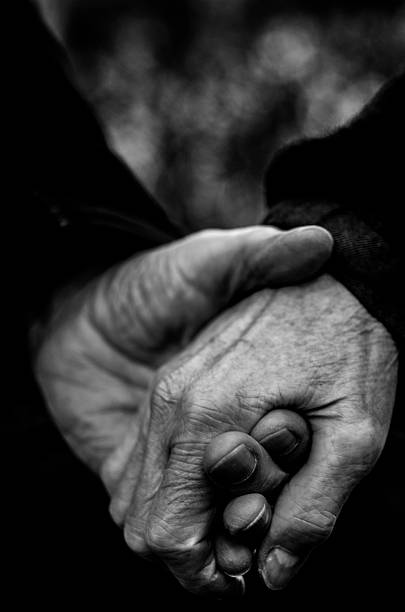 istock Old hands holding together, Monochrome Shot 510621878