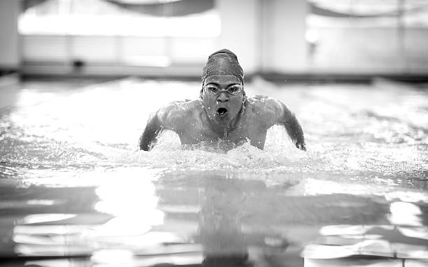 istock Young athletic man with butterfly swimming technique. 510625540