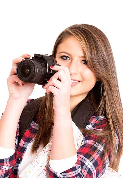 istock beautiful young girl with a camera isolated on white 510625868