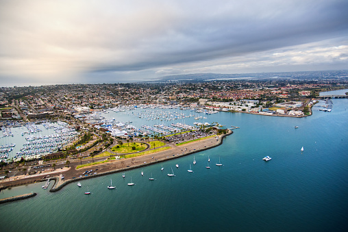An aerial view of Shelter Island on the San Diego Bay as a storm clears.  Shelter Island is home to marinas, restaurants, bars and the famous Humphrey's By The Bay music venue.  I shot this photograph from approximately 300 feet elevation during a chartered photo-flight of the region.