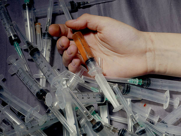 Photo a of human hand with syringe stock photo