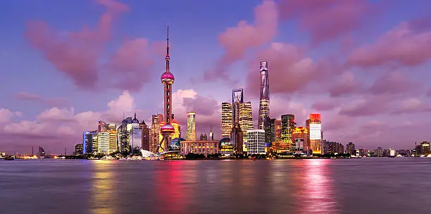 Twilight shot with the Pudong district skyline and the Huangpu river in Shanghai, China
