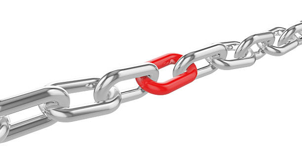 istock Chrome chain with a red link at the center. 510627158
