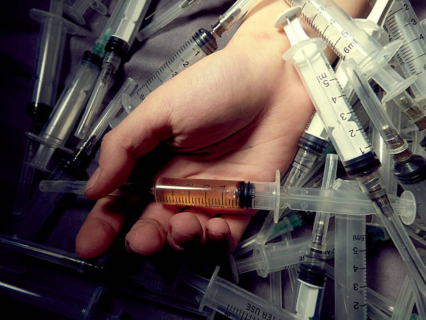 Photo a of human hand with syringe stock photo