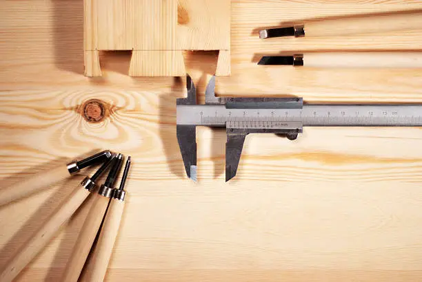 carving,chisel,chisel,tool,wood material,workpiece,shavings,manual labor,wood,vintage,warm tone,dovetail,caliper,measurement