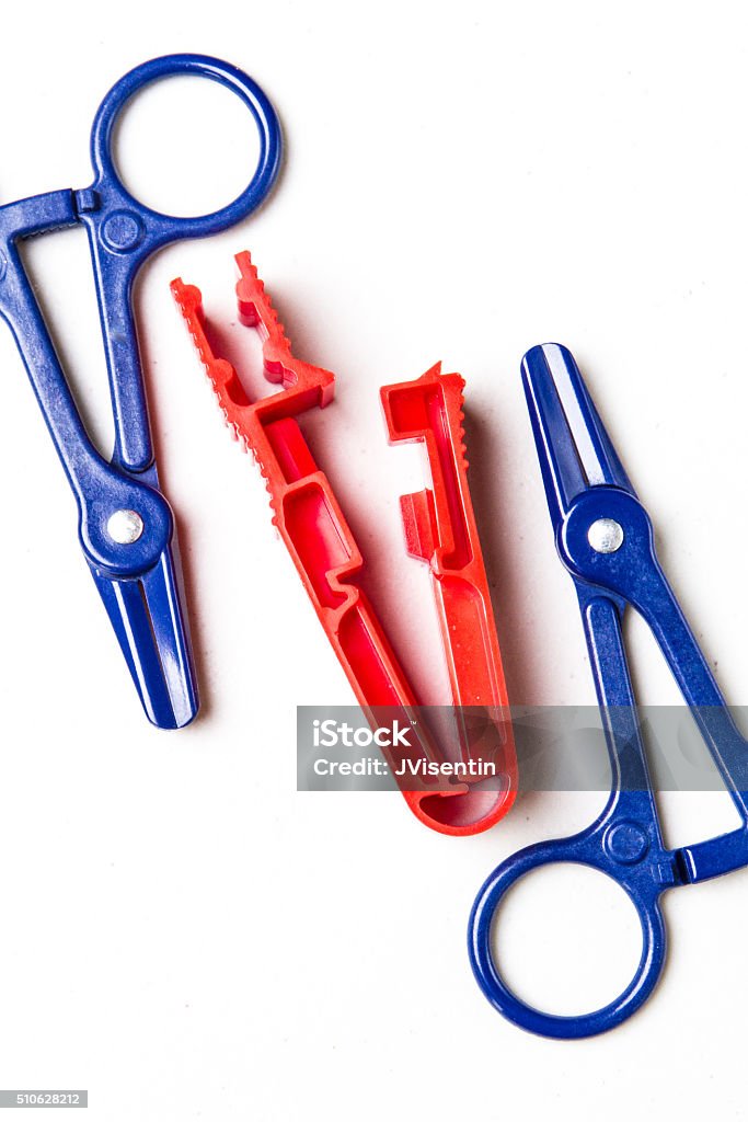 Nephrology Instrumentation Clamps used in peritoneal dialysis transfers. Blue Stock Photo