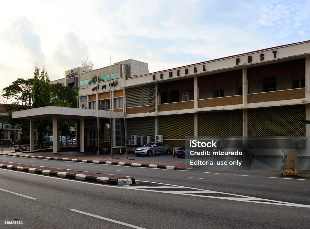 General Post Office, Bandar Seri Begawan, Brunei Bandar Seri Begawan, Brunei Darussalam - March 13, 2015: empty street and parked cars in front of the General Post Office Bandar Seri Begawan Stock Photo