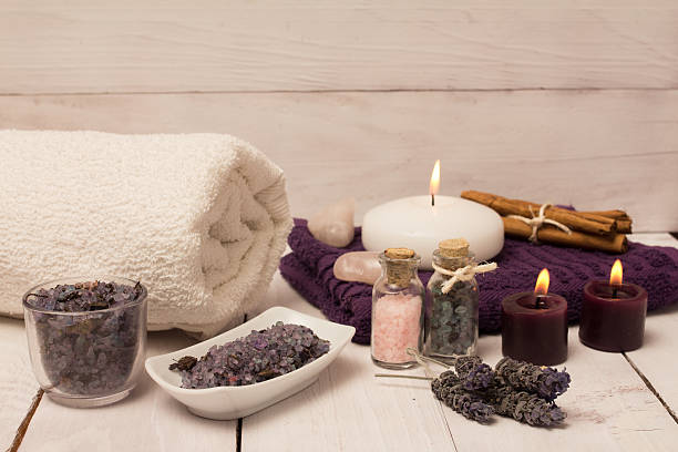 istock Lavender flower and bath salts spa, two purple candles 510629702
