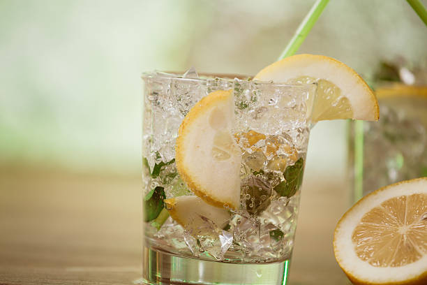 istock Lemonade with fresh lemon and mint by lemon reamer 510630410