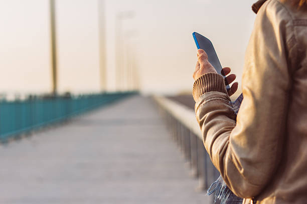 istock Young woman using smartphone 510631616