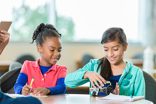 istock Elementary school friends build robot at STEM school 510631854