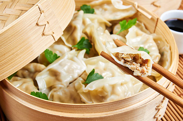 Steamed asian dumplings. Dumplings filled with vegetables Steamed asian dumplings. Dumplings with fillings steamed photos stock pictures, royalty-free photos & images