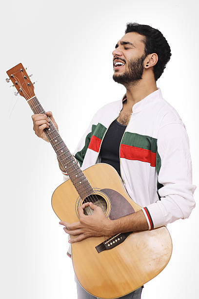 istock Young Men Playing Guitar And Singing Song Isolated On White 510632670