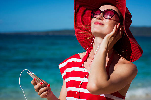 istock Young woman enjoying on the beach 510633080