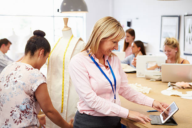 istock Teacher Helping College Students Studying Fashion And Design 510633191