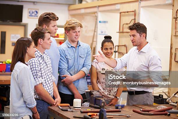 Teacher Helping College Students Studying Plumbing Stock Photo - Download Image Now - Trainee, Teenager, Teaching