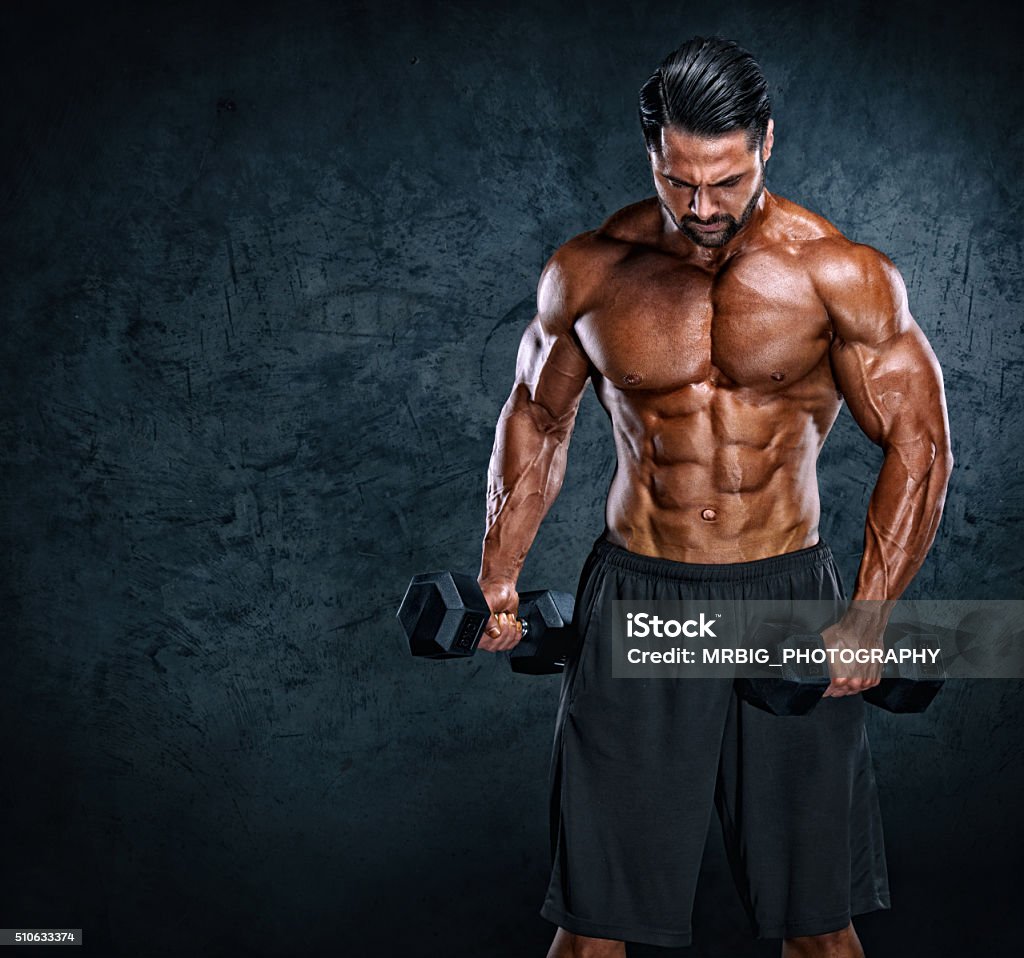 Iron Warrior Muscular Men Exercise With Dumbbells. Copy Space Abdominal Muscle Stock Photo