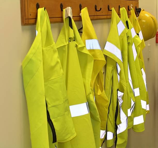 istock High vis safety vests on a coat rack 510634030