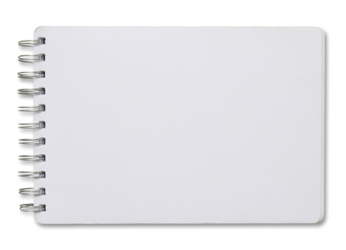 Cuaderno con espiral blanca en blanco photo