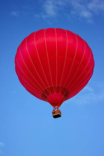 istock Red Hot Air Balloon In Blue Sky 510635036