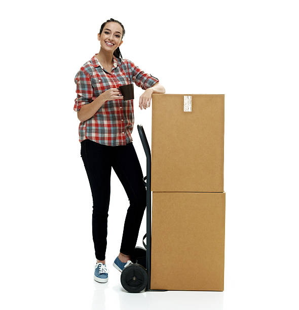 istock Smiling female holding coffee cup and box 510635512