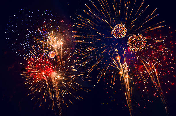 istock red, orange, blue and yellow fireworks 510635966