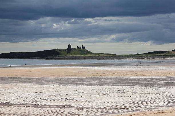 istock Dunstanburgh Castle with stormy skies 1 510636461