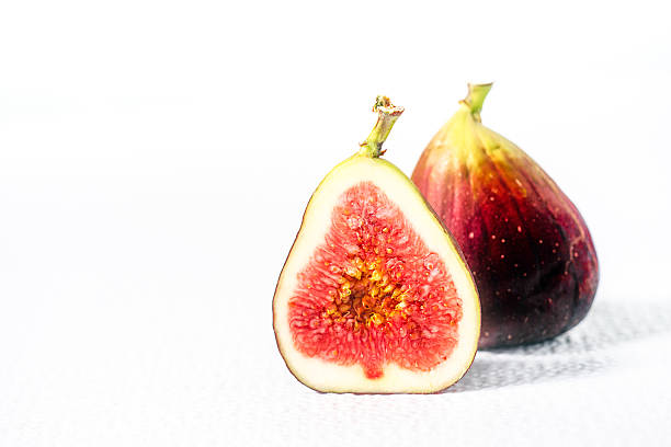 istock one fig and a half cut length way on white 510637082
