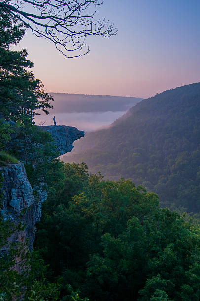 istock Hiker standing on a high rocky cliff 510637185