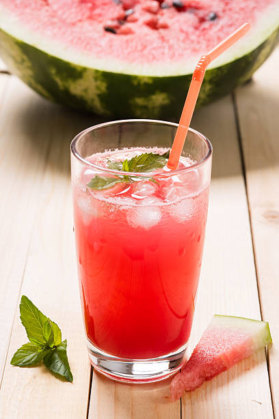 Freshly squeezed watermelon juice with mint and ice cubes