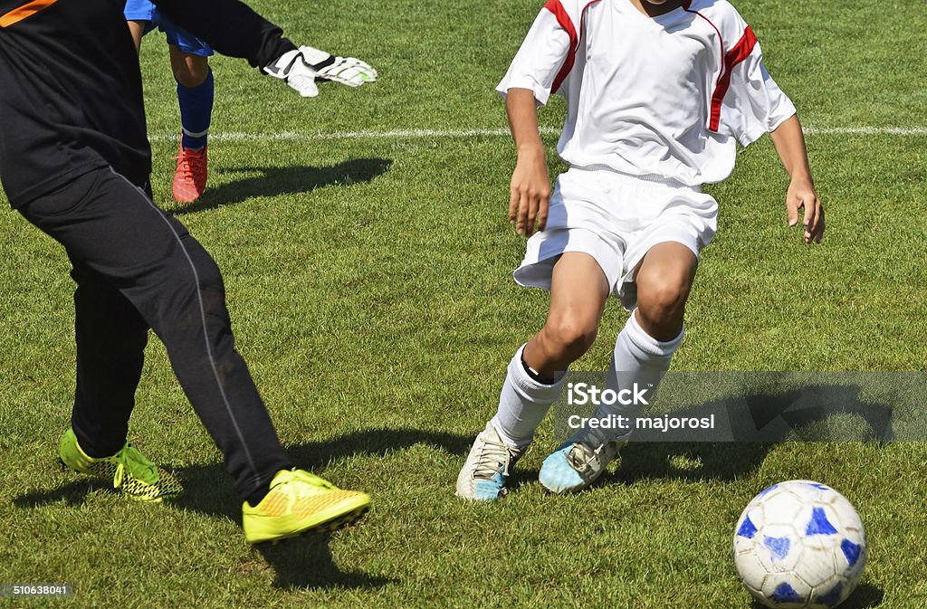 Kid soccer Kid soccer match Adult Stock Photo