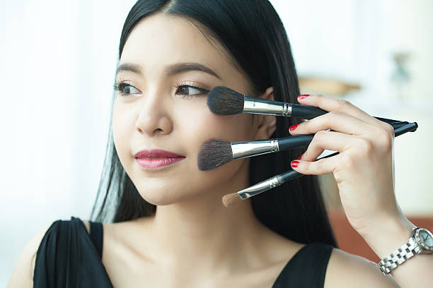 istock Asian woman holding brushes - beauty makeup concept 510639214
