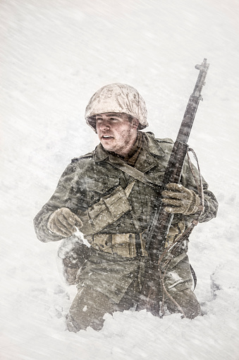 WWII US Infantry Soldier Blazing A trail through a bitter winter snow storm.