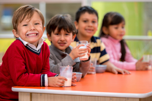 Kids on a school break drinking milk