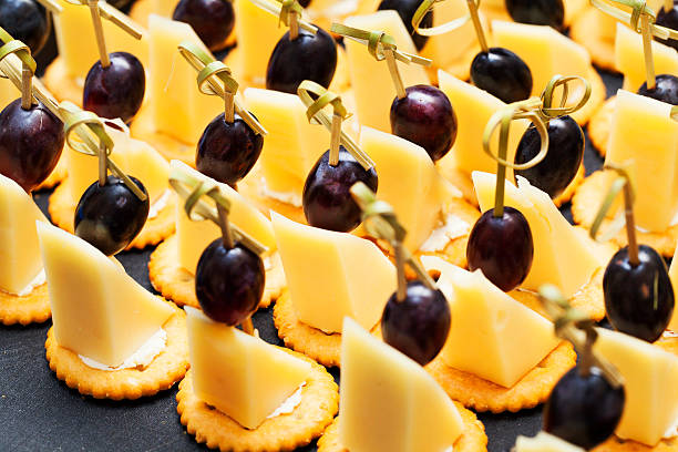 canapes with cheese, grapes stock photo