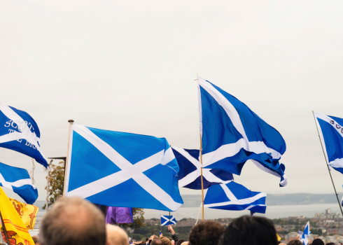 A crowd at a rally for Scottish Independence, waving saltire flags in support of a 'Yes' vote in the referendum to be held on 18th September 2014.