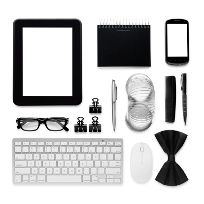 This is an overhead photo of a man's personal accessories isolated on a white background. There are no Apple products used in this photograph. 
