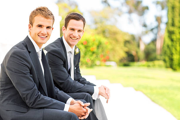 istock Best Man And Groom Sitting With Hands Clasped 510659849