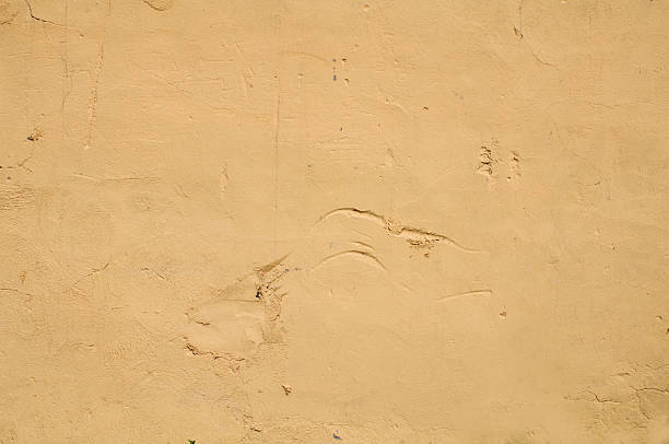 istock Wall texture with damaged plaster yellow 510662149