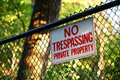 No trespassing private property sign on a fence