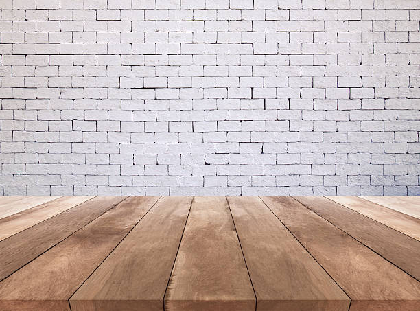istock wooden floor and white brick wall texture background 510673952