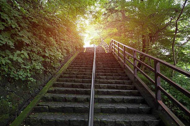 istock stairs going up to the light 510674336