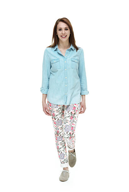 istock Smiling female walking and looking at camera 510674420