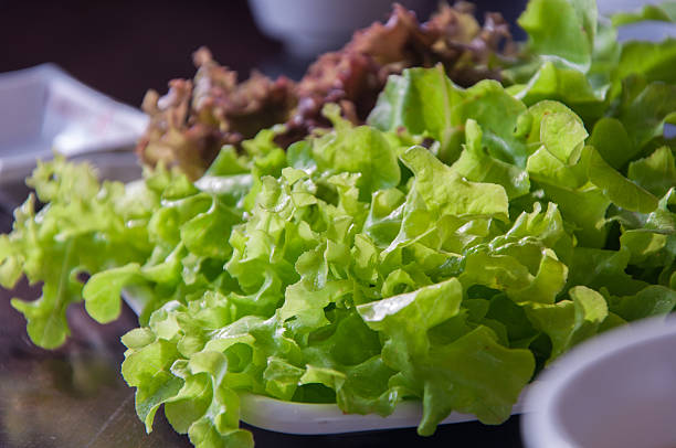 istock fresh green and red oak leaves on table 510678800