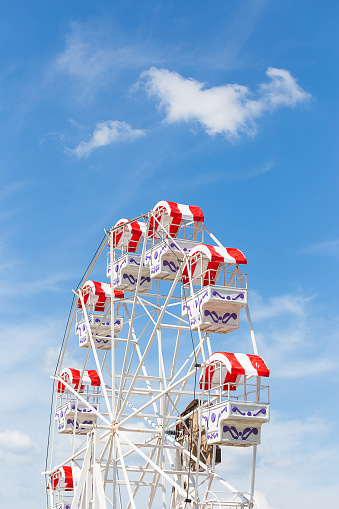 red Ferris wheel with blue skyred Ferris wheel with blue sky