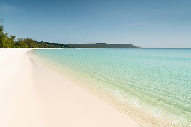Beautiful endless long dream beach on a small cambodian island, turquoise clean water and a sunny blue sky, Sihanoukville -  Chhak Kampong Som - Koh Rong Area - Gulf of Thailand, South Cambodia, Asia