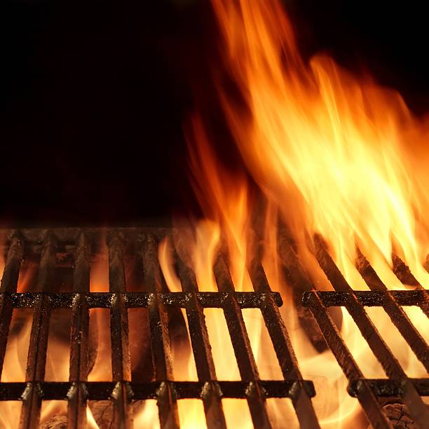 istock Empty Flaming Barbecue Grill Isolated On Black Background. Top V 510680720