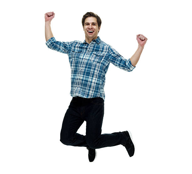 istock Smiling casual man jumping and cheering 510682344