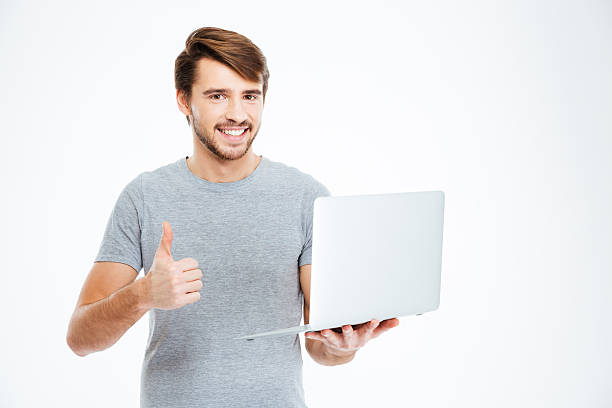 istock Man holding laptop computer and showing thumb up 510682440